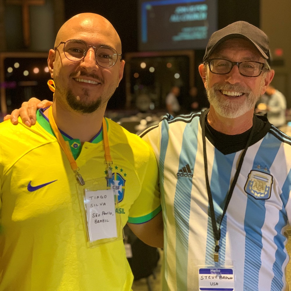 Tiago Silva (left) and Steve Brown fellowship and support their favorite soccer team.